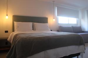 Cama ou camas em um quarto em Hotel Florinda