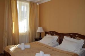 Ένα ή περισσότερα κρεβάτια σε δωμάτιο στο Eurika +27 φωτογραφίες