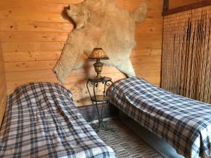 Кровать или кровати в номере Гостевой дом на Калинина 12