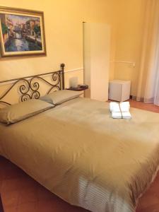 a bedroom with a large bed with two towels on it at B&B Lumasa in Vietri sul Mare