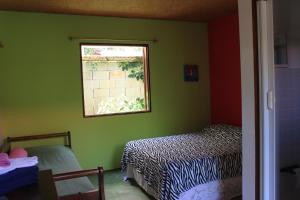 Postel nebo postele na pokoji v ubytování Pousada O Canto das Sereias