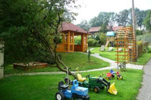 a group of toys sitting in the grass in a yard at Ferienhof Hübner in Bad Berneck im Fichtelgebirge