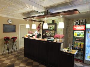 a bar in a restaurant with a soda machine at Zajazd Galicja in Dukla