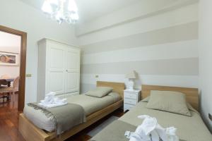 A bed or beds in a room at Holidays Banchi Nuovi