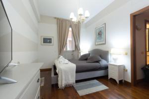 a small bedroom with a bed and a window at Holidays Banchi Nuovi in Rome