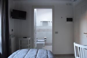 Un pat sau paturi într-o cameră la Residence Il Portico