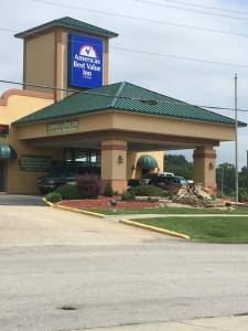 a building with a sign on top of it at Americas Best Value Inn Mount Vernon in Mount Vernon