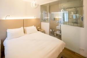 Voodi või voodid majutusasutuse Hotel Campione toas