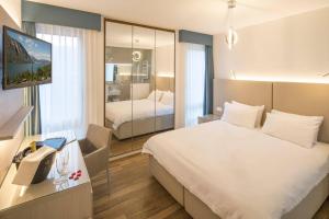 Voodi või voodid majutusasutuse Hotel Campione toas