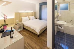Voodi või voodid majutusasutuse Hotel Campione toas