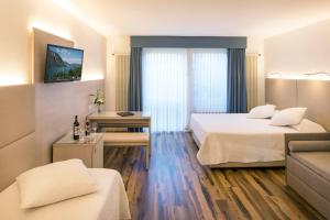 Voodi või voodid majutusasutuse Hotel Campione toas