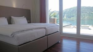 Voodi või voodid majutusasutuse Hotel Campione toas