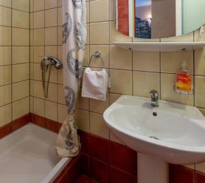 a bathroom with a sink and a shower at Leonarda in Crikvenica +17 photos