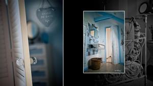 a door with a picture of a blue room at la lande huel in Saint-Brandan +31 photos