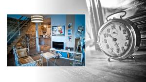a room with a clock in the middle of a room at la lande huel in Saint-Brandan
