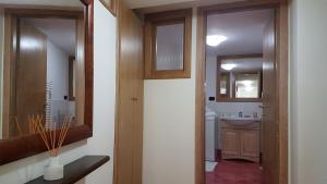 a bathroom with a sink and a mirror at La Residenza di Carolina in Cassino +34 photos