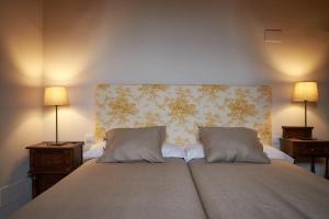 Postel nebo postele na pokoji v ubytování Casa Rural Victoriano Pedraza