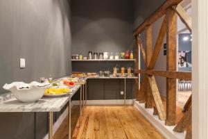 a kitchen with a sink and a counter top at Lisbon Cheese & Wine Suites in Lisbon