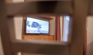 Televízia a/alebo spoločenská miestnosť v ubytovaní Appartment Salino