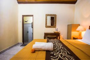 Postel nebo postele na pokoji v ubytování Dijumahrai Homestay