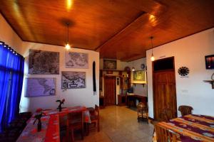 a living room with a table and a dining room at World BnB in Labuan Bajo