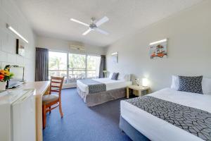 Postel nebo postele na pokoji v ubytování Camelot Motel + 32 fotografií