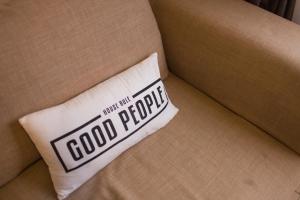 a white pillow with the words good price on it on a couch at Szhnn's Vacation Apartment in Kota Kinabalu