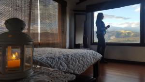 Postel nebo postele na pokoji v ubytování Hostal Casa Lantana