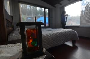 Postel nebo postele na pokoji v ubytování Hostal Casa Lantana