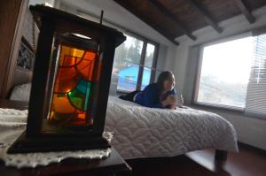 Postel nebo postele na pokoji v ubytování Hostal Casa Lantana