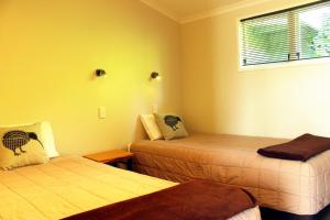 Postel nebo postele na pokoji v ubytování Te Awa Motel