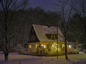 a house with christmas lights on the front of it at Sängerwiese in Eisenach