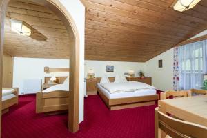 Postel nebo postele na pokoji v ubytování Hotel Sonnhof