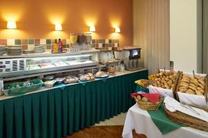 a kitchen filled with lots of different types of food at Hotel Ankora in Prague