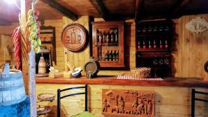 a bar in a room with bottles of wine at Albergo Diffuso Borgo Santa Caterina "Quartire Hebraic" in Castiglione di Sicilia