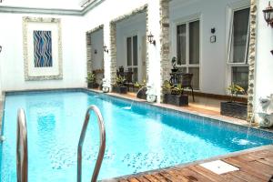 a swimming pool in the middle of a house at Sun Rise House in Jakarta