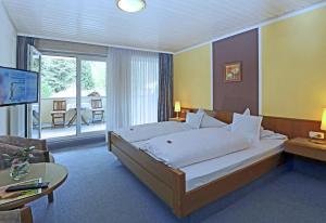 מיטה או מיטות בחדר ב-Landgasthof zur Linde