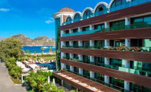 a hotel with a view of the ocean and a resort at Elite World Marmaris - Adult Only in Marmaris