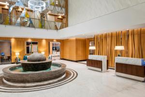 a lobby with a fountain in the middle of a building at Elite World Marmaris - Adult Only in Marmaris