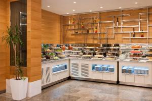 a large kitchen with a lot of food at Elite World Marmaris - Adult Only in Marmaris