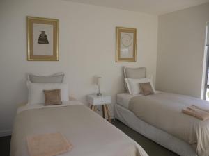 Ένα ή περισσότερα κρεβάτια σε δωμάτιο στο Spectacular Holiday Living