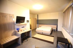 Postel nebo postele na pokoji v ubytování Valtidone Hotel