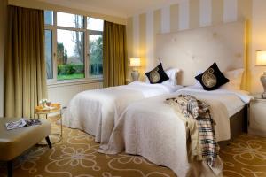 A bed or beds in a room at Great Southern Killarney
