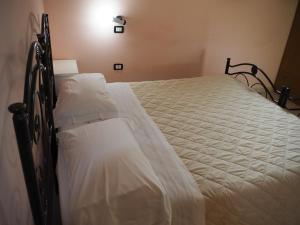 Postel nebo postele na pokoji v ubytování Il Rifugio dell'Ape Agriturismo
