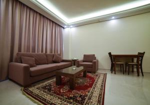 Zona de estar de Al Jawhara Suites