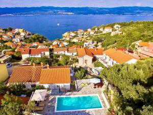 an aerial view of a house with a swimming pool at Bura in Vrbnik