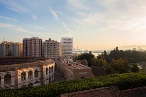 a view of a city with tall buildings at Hotel Eliseos in M&aacute;laga
