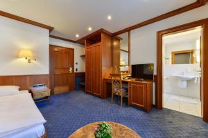 Postel nebo postele na pokoji v ubytování Hotel Fischerwirt + 34 fotografií