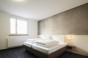 Postel nebo postele na pokoji v ubytování a2 HOTELS Plochingen