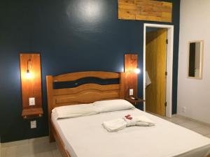 Cama ou camas em um quarto em Pousada Vila Appia